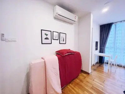 a living room with a red couch and a heater at [Promo] Connected Train 2 Bedroom (ABOVE MALL) 28 in Kuala Lumpur