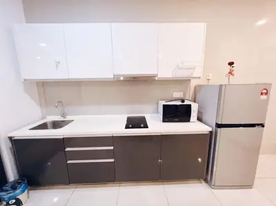a kitchen with a sink and a refrigerator at [Promo] Connected Train 2 Bedroom (ABOVE MALL) 28 in Kuala Lumpur