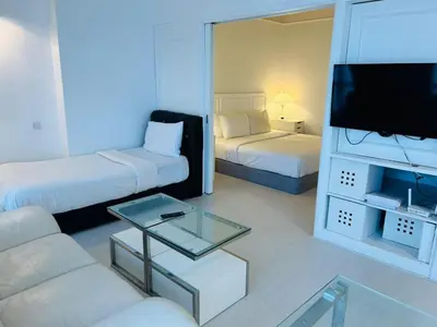 a living room with a couch and a tv at MN SUITE At TIMES SQUARE KL in Kuala Lumpur