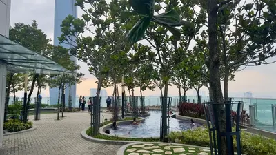 a pool on the top of a building with trees at The Robertson Residence Bukit Bintang 20F in Kuala Lumpur