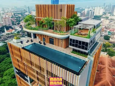a building with a swimming pool on top of it at Ceylonz KLCC by Mana-Mana in Kuala Lumpur