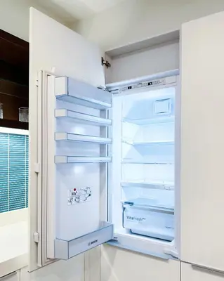 an empty refrigerator with its door open in a kitchen at Tropicana The Residence LV Suite with KLCC View in Kuala Lumpur
