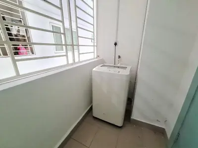 a small white refrigerator in a room with a window at Crest Residence Klcc Bukit Bintang by Sarah's Lodge in Kuala Lumpur