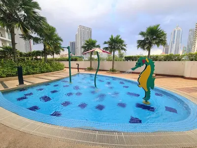 a pool with a dinosaur in the middle of it at Crest Residence Klcc Bukit Bintang by Sarah's Lodge in Kuala Lumpur