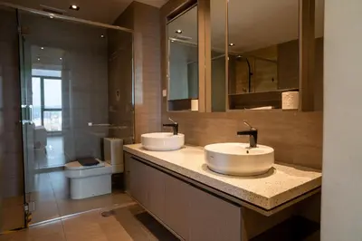 a bathroom with two sinks and a toilet at EXPRESSIONZ KLCC BY MANA-MANA in Kuala Lumpur