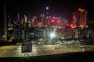 a city skyline at night with a large parking lot at Massive KL View at M-Vertica by HCK in Kuala Lumpur