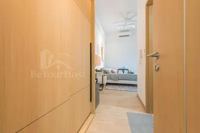 a corridor with a door leading to a bedroom at The Colony by Infinitum Kuala Lumpur in Kuala Lumpur