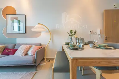 a living room with a couch and a table at The Colony by Infinitum Kuala Lumpur in Kuala Lumpur