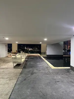 a large empty room with benches in a building at KLCC Kampung Baru Cottage - Homestay in Kuala Lumpur