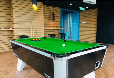 a pool table with a ball on top of it at S36- Robertson at Bukit Bintang 3 Bedroom with Netflix in Kuala Lumpur