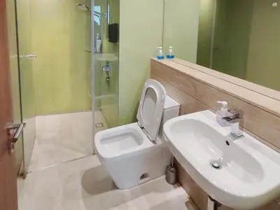a bathroom with a sink and a toilet and a shower at Luxury 2BR Home in Vortex Stunning KL Tower View Free WiFi in Kuala Lumpur