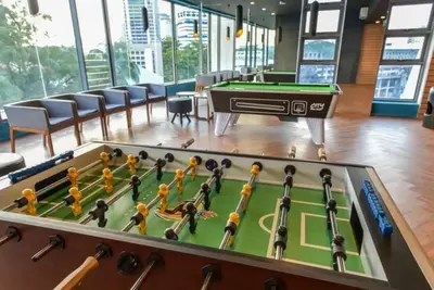 a pool table in a room with a billiards at S27- Bukit Bintang Robertson 3BR Suite with Netflix in Kuala Lumpur