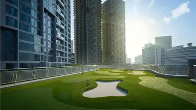 a golf course in the middle of a city with tall buildings at S27- Bukit Bintang Robertson 3BR Suite with Netflix in Kuala Lumpur