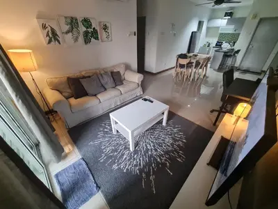 a living room with a couch and a coffee table at 1 min Next to LRT CHERAS 68 in Kuala Lumpur