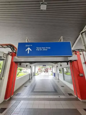 a train station with a blue sign in a hallway at 1 min Next to LRT CHERAS 68 in Kuala Lumpur
