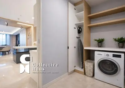 a laundry room with a washer and dryer at Tropicana Residence Kuala Lumpur by Collective Haus in Kuala Lumpur