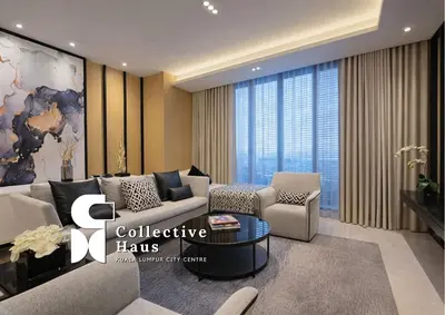 a living room with a couch and a table at Tropicana Residence Kuala Lumpur by Collective Haus in Kuala Lumpur