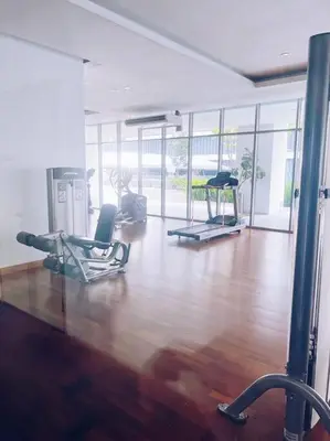 a gym with two chairs and a wooden floor at PROMO CONNECTED TRAIN 1 Bedroom ABOVE MALL - 5 in Kuala Lumpur