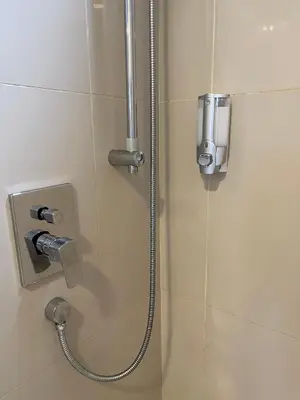 a shower with a hose in a bathroom at 7PAX Kepong DesaPark Publika MontKiara 100Mbps in Kuala Lumpur