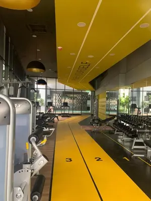 a gym with a yellow floor and rows of chairs at Neu suites 007- 2 bedrooms klcc in Kuala Lumpur