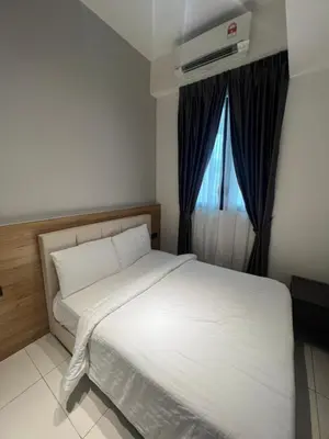 a bedroom with a white bed and a window at Opus Residences KL Merdeka 118 View in Kuala Lumpur