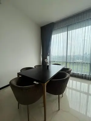 a table and chairs in a room with a large window at Opus Residences KL Merdeka 118 View in Kuala Lumpur