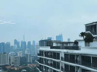 a building with a city in the background at Stylish KL Suite, KLCC View, Next to LRT, Datum Jelatek By Atlantis Management in Kuala Lumpur