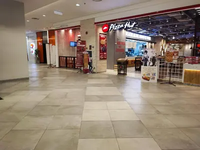 a shopping mall hallway with a store at Stylish KL Suite, KLCC View, Next to LRT, Datum Jelatek By Atlantis Management in Kuala Lumpur