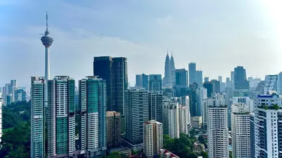 a view of a city skyline with the space needle at Skyline view in Bukit Bintang The Robertson 42f in Kuala Lumpur