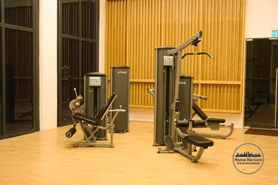 a gym with two treadmills and two exercise bikes at Lucentia Residence By Home Horizon in Kuala Lumpur