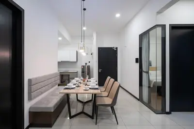 a dining room with a table and chairs at Opus KL Residences by Premium Hospitality in Kuala Lumpur