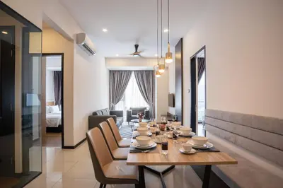 a dining room with a table and chairs at Opus KL Residences by Premium Hospitality in Kuala Lumpur