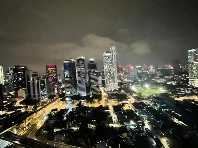a view of a city at night with buildings at Mercu Summer Suite KLCC by Kuminshu in Kuala Lumpur