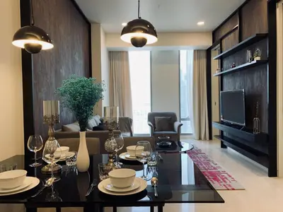 a living room with a table and a television at Tropicana The Residences KLCC, Premium in Kuala Lumpur
