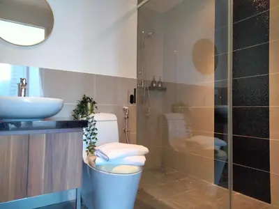 a bathroom with a toilet and a sink at Bangsar Trade Center Studio 4pax I HomeBrickz in Kuala Lumpur
