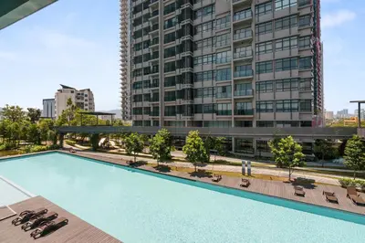 an empty swimming pool in front of a tall building at ASTORIA AMPANG in Kuala Lumpur