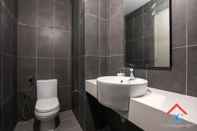 a bathroom with a toilet and a sink and a mirror at ASTORIA AMPANG in Kuala Lumpur