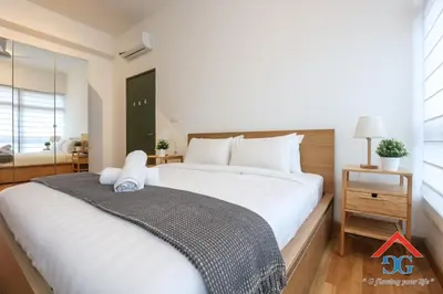 a bedroom with a large white bed and a window at ASTORIA AMPANG in Kuala Lumpur