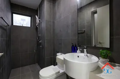 a bathroom with a white sink and a toilet at ASTORIA AMPANG in Kuala Lumpur