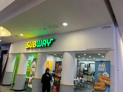 a person standing in front of a store at KSM GLOBAL APARTMENT At TIMES SQUARE kl in Kuala Lumpur