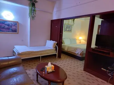 a room with a living room with a couch and a tv at PERFECT HOME STAY at TIMES SQUARE in Kuala Lumpur