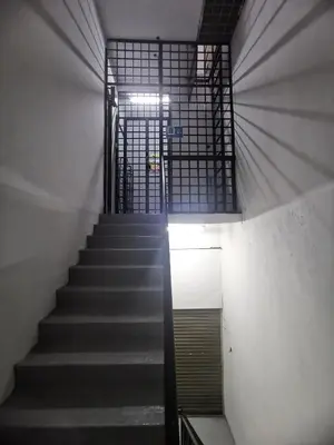 a staircase in a building with a stair case at Blue house KL Homestay in Kuala Lumpur