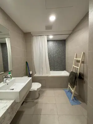 a bathroom with a sink and a tub and a toilet at The Ooak Suites by Bamboo Hospitality in Kuala Lumpur
