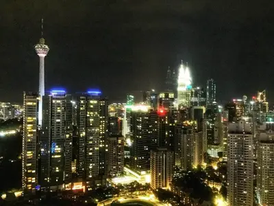 a city skyline at night with a lot of tall buildings at Meta @ Robertson KL Bukit Bintang in Kuala Lumpur