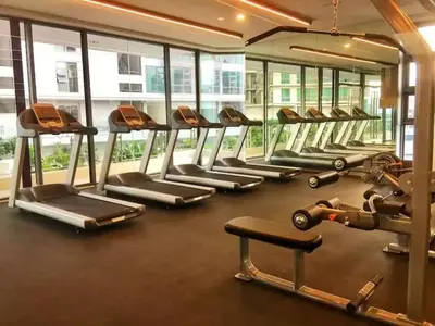 a gym with a row of treadms and machines at Meta @ Robertson KL Bukit Bintang in Kuala Lumpur