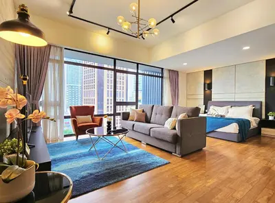 a living room with a couch and a bed at Anggun Homestay King Bed Studio KL City Bukit Bintang by Cloud Host in Kuala Lumpur