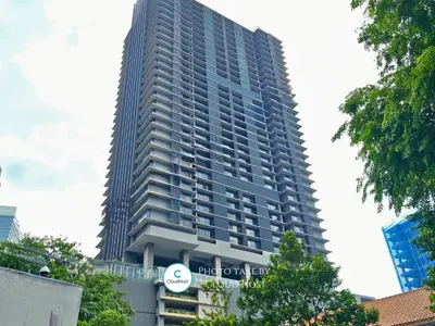 a tall building with a sign in front of it at Anggun Homestay King Bed Studio KL City Bukit Bintang by Cloud Host in Kuala Lumpur
