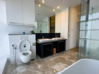 a white bathroom with a toilet and a sink at The Platinum KLCC in Kuala Lumpur