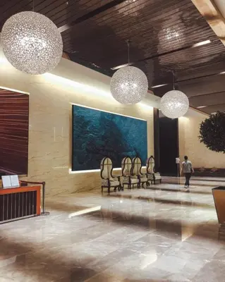 a room with chairs and a large painting on the wall at The Platinum KLCC in Kuala Lumpur