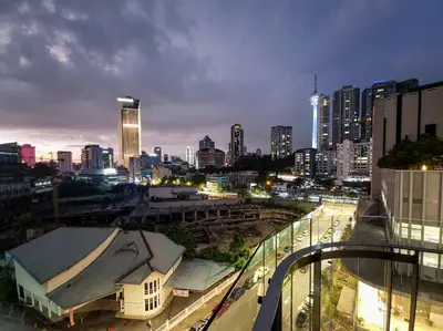 a view of a city skyline at night at The Robertson @ 118 Tower Super View in Kuala Lumpur